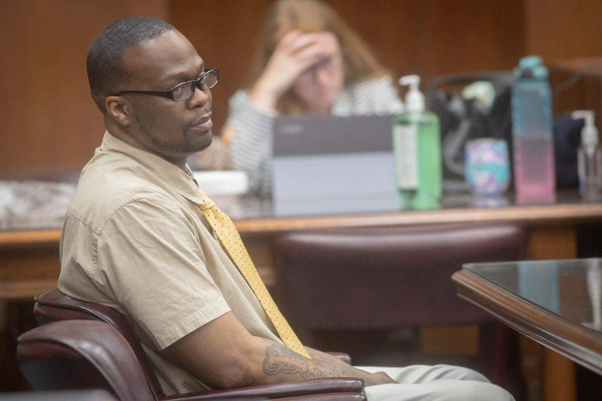 Rushaun Burton watches closing arguments in the trial for murder charges levied upon him after the 2018 fatal shooting of Rashard Williams, at the Government Center in Columbus, Ga. on Jan. 6, 2022.