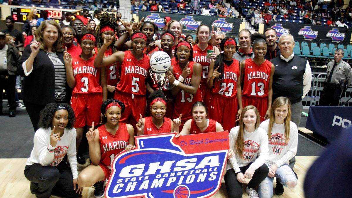The Marion County girl’s basketball team poses after winning the GHSA-A public girls championship. It’s the first-ever title win for the team.