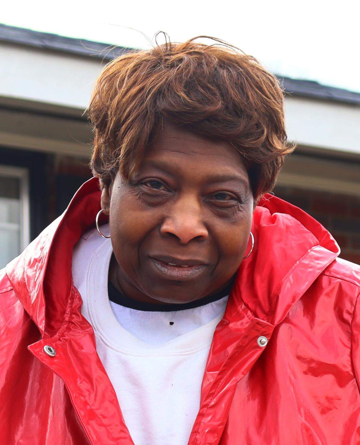 Vivian Nelson,70, stands in front of her house in Columbus, Georgia. Nelson’s broken A/C and heater were fixed for free through the weatherization program in early January. 1/16/2024.