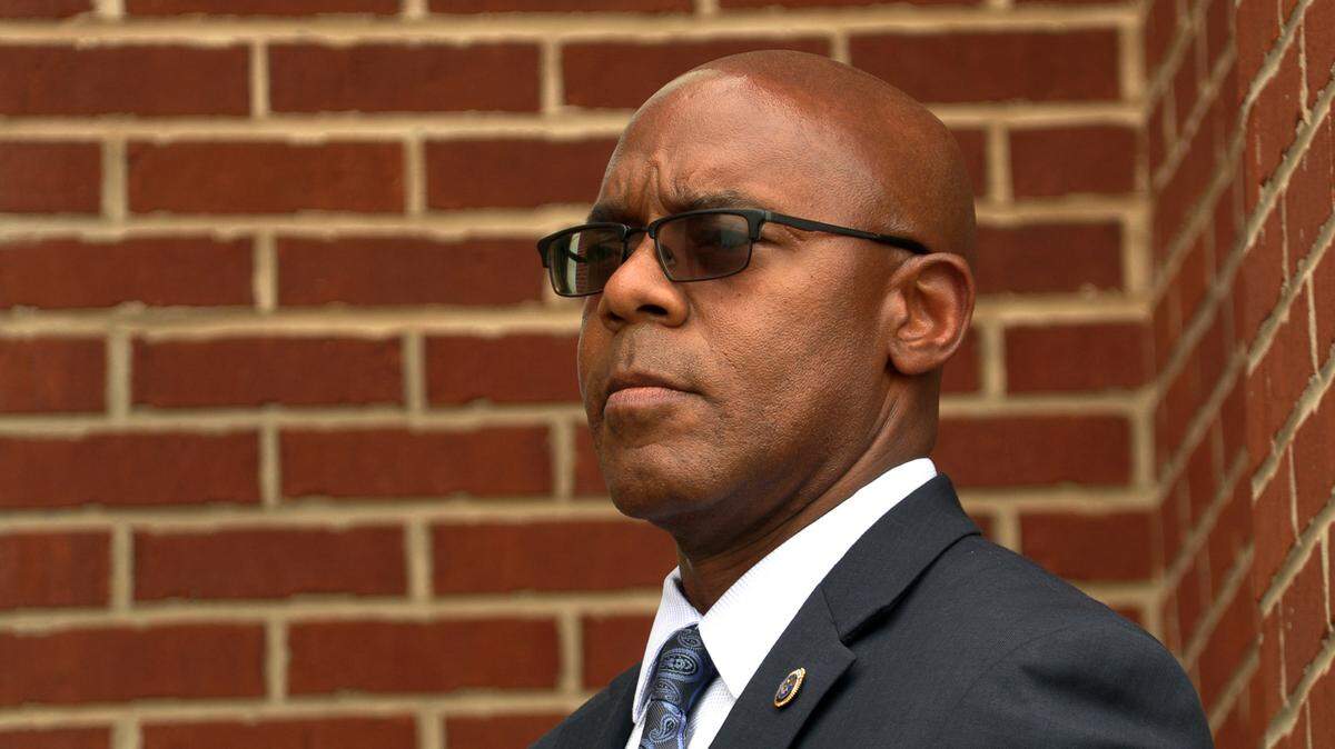 Columbus Police Chief Freddie Blackmon listens to a speaker during a Tuesday evening rally outside the City Services Center prior to Tuesday night’s Columbus Council meeting. 03/28/2023