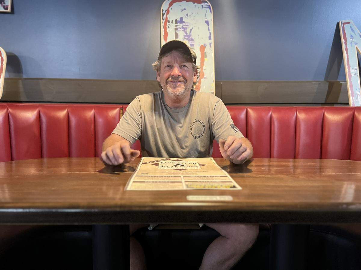 Luke’s Pub & Steakhouse co-owner Bobby Noland sits in a booth June 4, 2026, at the restaurant’s upcoming location in Columbus. The restaurant’s location in Pine Mountain will remain open.