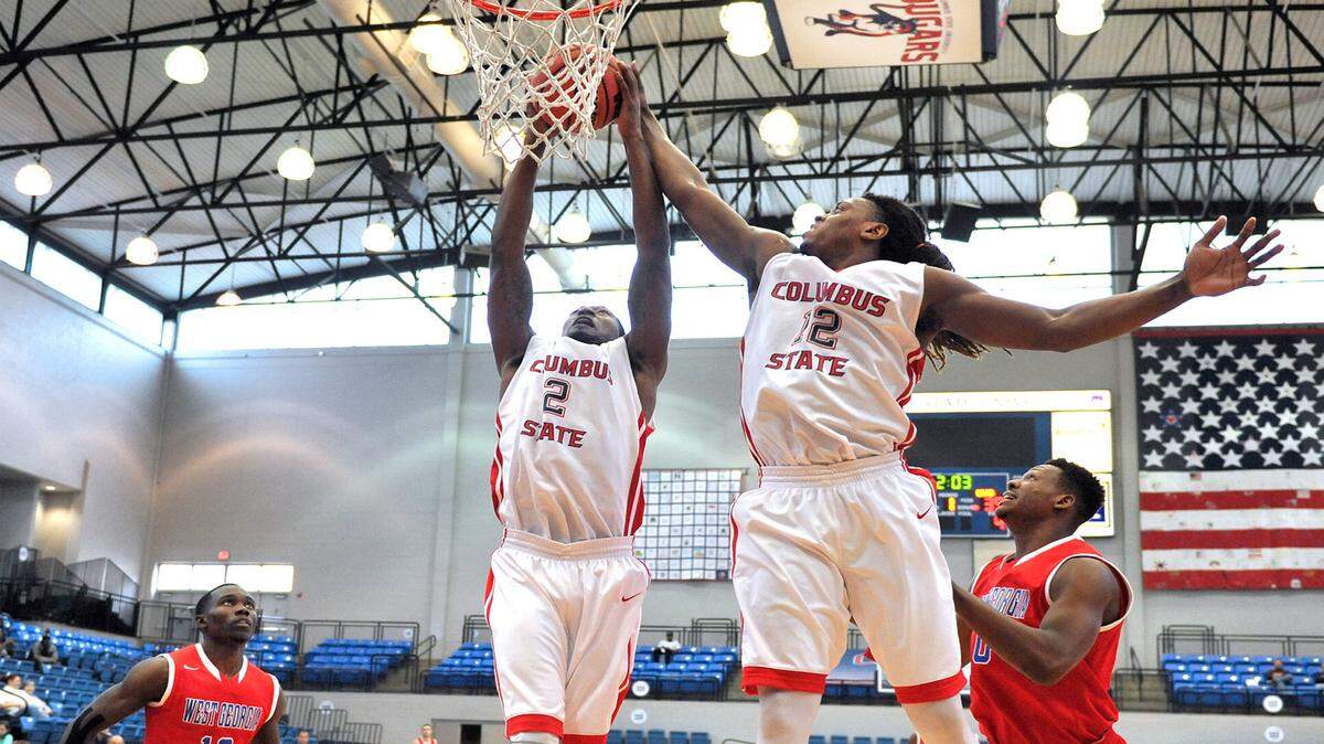 CSU's Darren Daniel and Brentine Taylor going up for the defensive rebound in the first period of the game against West Georgia Saturday afternoon at CSU, November 21, 2015