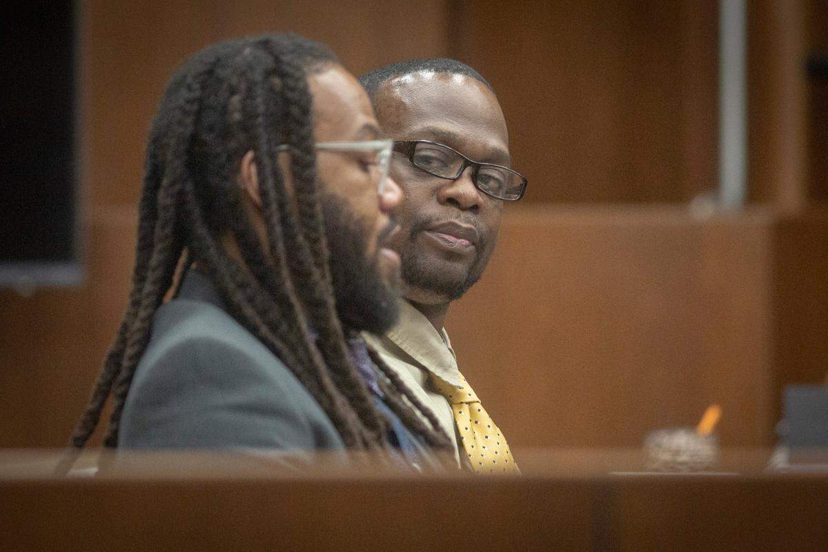 Rushaun Burton, charged with the 2018 murder of Rashard Williams, talks to his lawyer after closing arguments in his trial at the Government Center in Columbus, Ga. on Jan. 6, 2022.