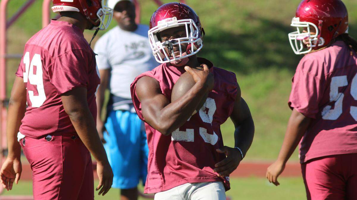 Carver RB Darius Love takes a carry during practice on Wednesday at the school.
