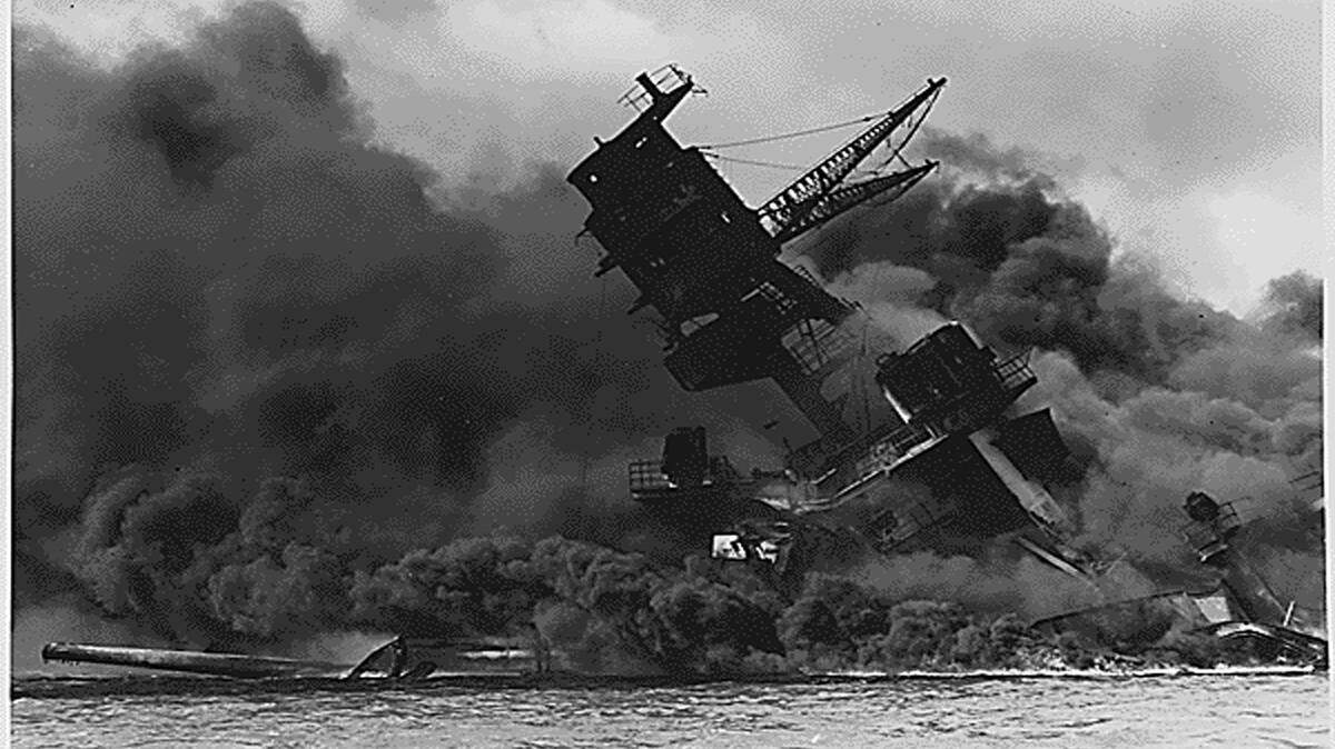 The USS Arizona (BB-39) burns after the Japanese attack on Pearl Harbor on December 7, 1941. (National Archives/Tribune News Service)