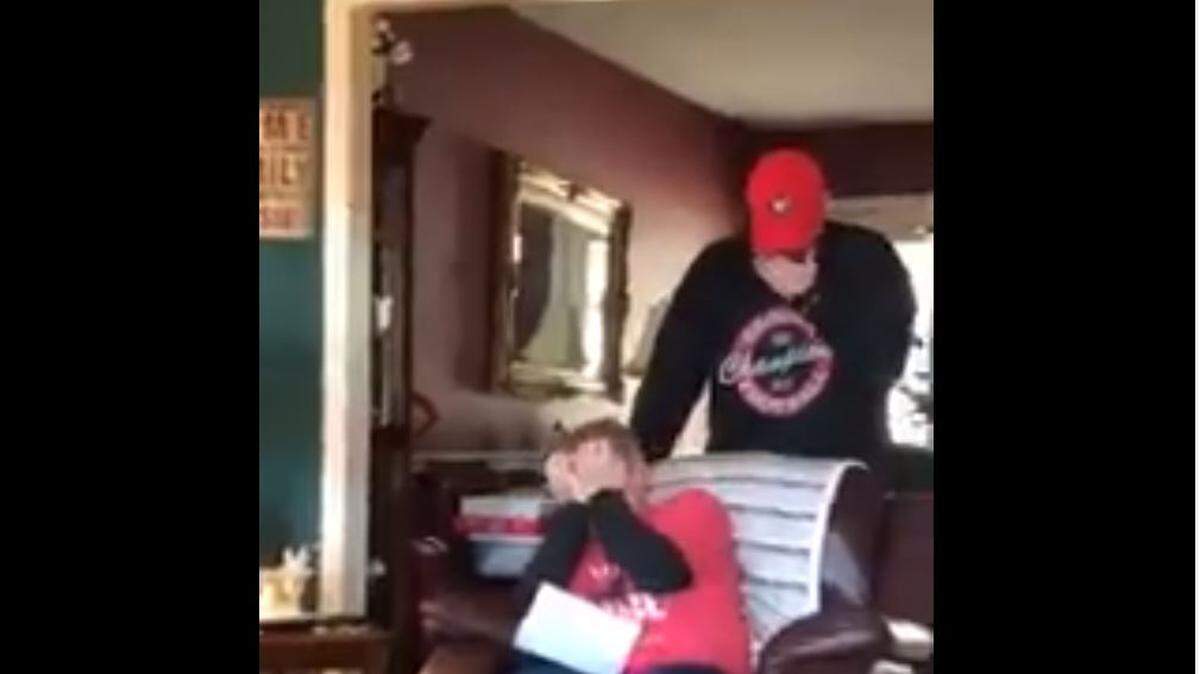 A Georgia fan broke down in tears when his son surprised him with tickets to the Georgia/Alabama championship game in Atlanta.