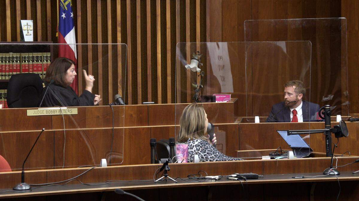 Judge Katherine Lumsden lectures attorney Chris Breault on limiting his answers to the questions he is asked, and warns him he will be held in contempt of court.