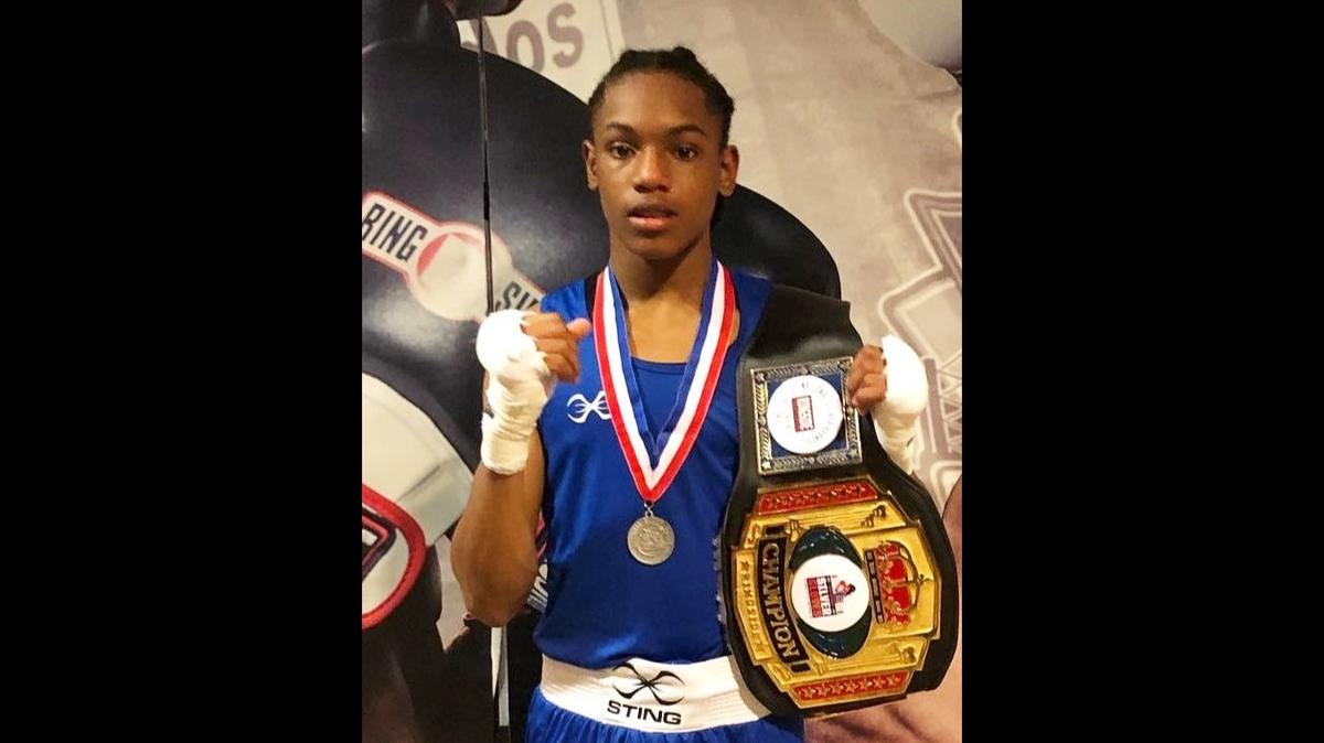 Naseia Richardson-Moore, 16, of Columbus holds the belt he won after his victory in the 132-pound age 15-16 division final bout at the 2022 national Silver Gloves boxing championships Feb. 5 in Independence, Missouri.
