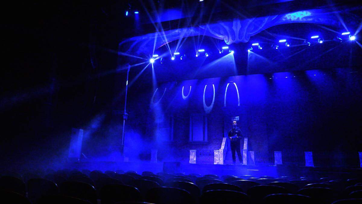 Ethan Hall runs through lighting cues prior to a dress rehearsal of “A Christmas to Believe In” at RiverCenter for the Performing Arts in Columbus, Georgia.