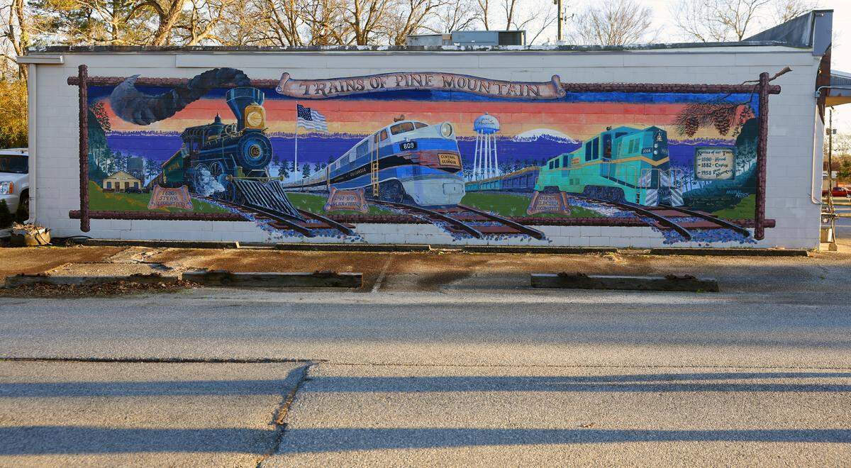 The Trains Mural, by John Christian, is about 600 square feet and painted on the Broad Street side of the Old South Bazaar Antiques building, 134 McDougald Ave., in downtown Pine Mountain.