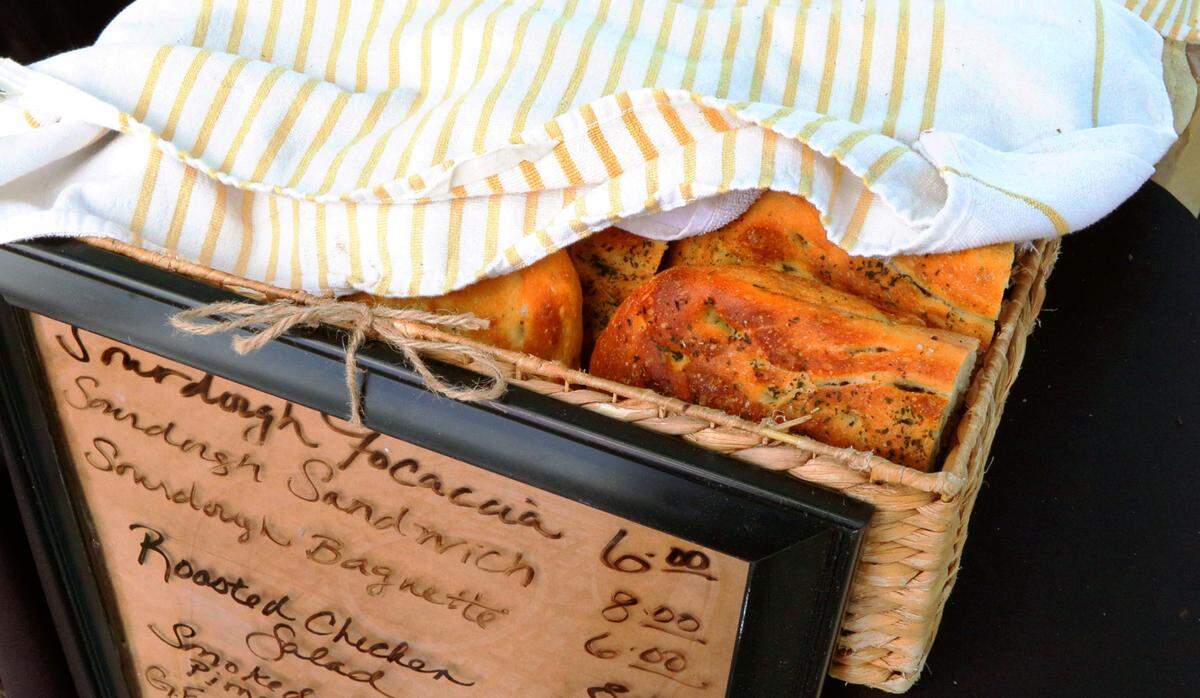 Kate Williams, chef and owner of The Old School Kitchen, sells a variety of baked goods at Market Days on Broadway in Columbus, including sourdough focaccia bread. 05/24/2025