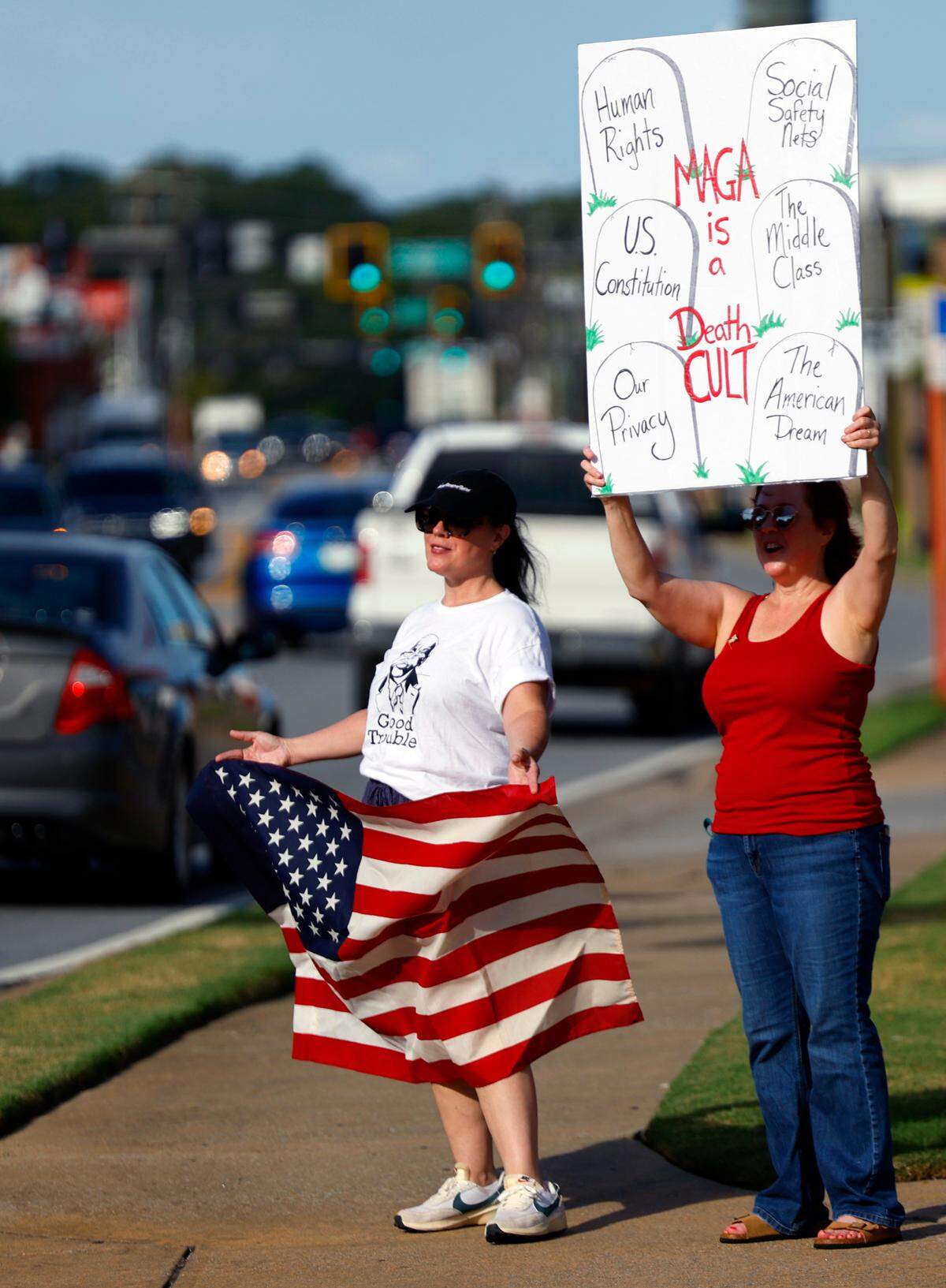 Local residents gathered July 17, 2025, at several intersection along Wynnton and Macon roads in Columbus as part of the “Good Trouble Lives On” protest to honor the legacy of civil rights activist and politician John Lewis of Georgia, who died July 17, 2020. The event was organized by Columbus Indivisible.
