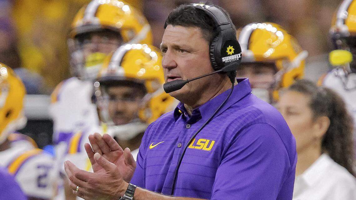 In this Saturday, Sept. 2, 2017, file photo, LSU head coach Ed Orgeron claps during an NCAA college football game against BYU in New Orleans