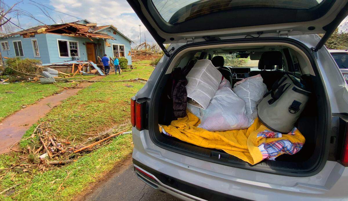 Family members of Sherry Bennett helped her salvage personal belongings from her home for 44 years in Troup County, Georgia. 03/27/2023