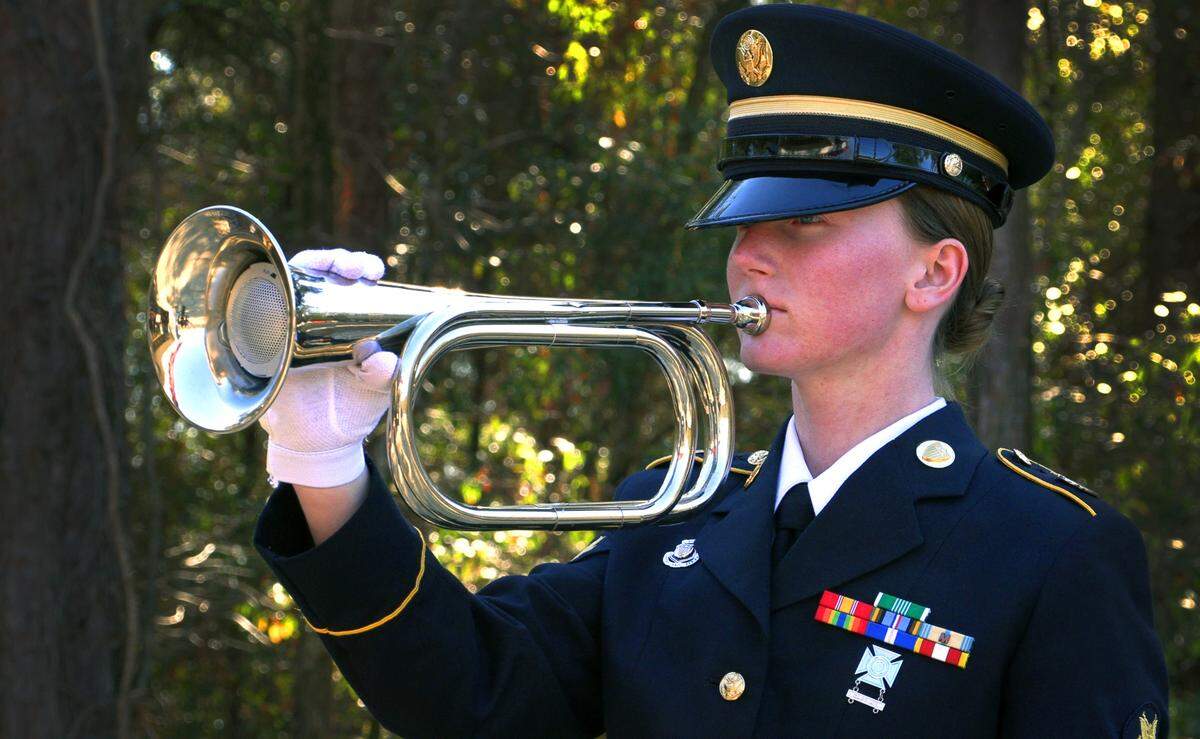 Taps is played during a funeral with military honors for Tommy Lee Harvey Jr. Thursday afternoon at Fort Mitchell National Cemetery in Alabama. Harvey died in December of 2017 and was previously  interred in a pauper grave at Porterdale Cemetery in Columbus, Georgia. 01/04/2024