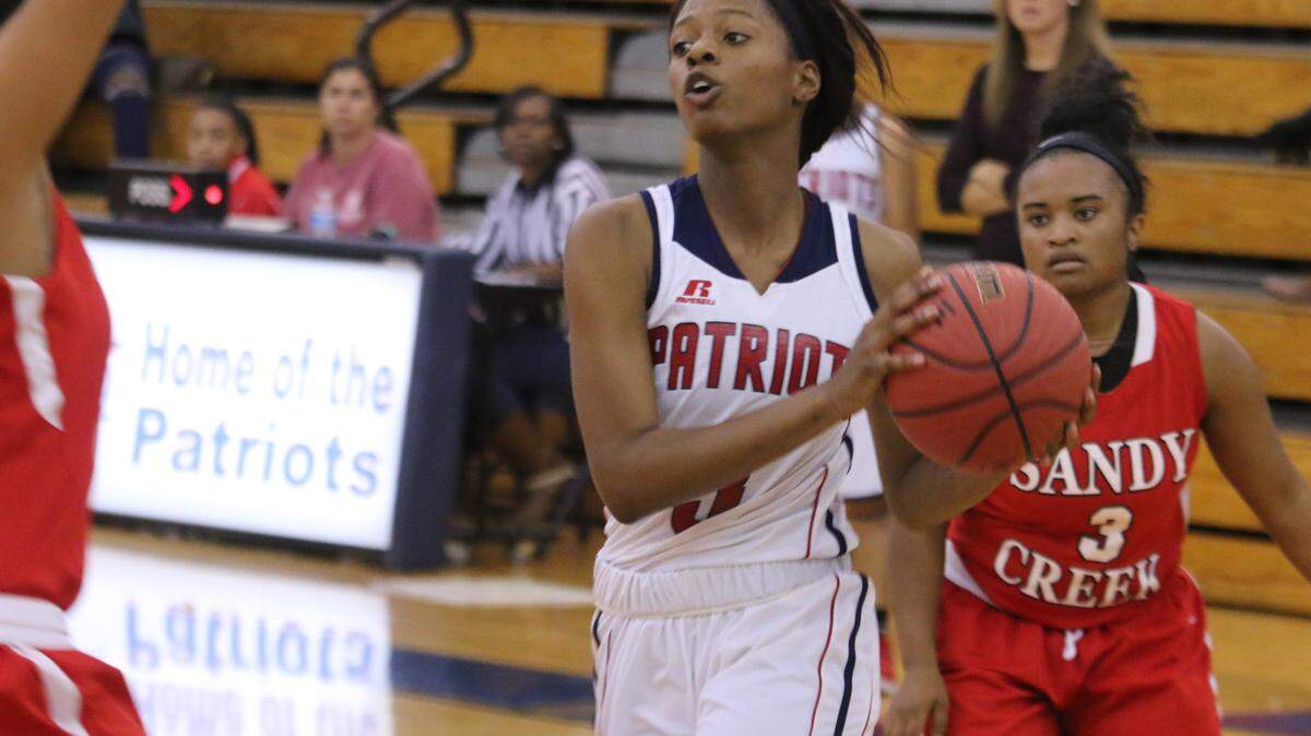 Northside's Caitlyn Jakes drives to the basket on Monday during the Lady Patriots' 61-42 win over Sandy Creek in the Shaw Christmas Tournament.