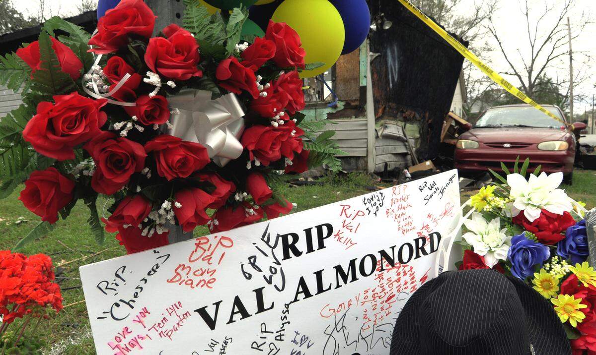 A memorial to Val Almonord, 37, is at the corner of 14th Avenue and 16th Street in Columbus, Georgia. Almonord died in a fire Friday at what remains of this house at 1601 14th Ave. 03/08/2022