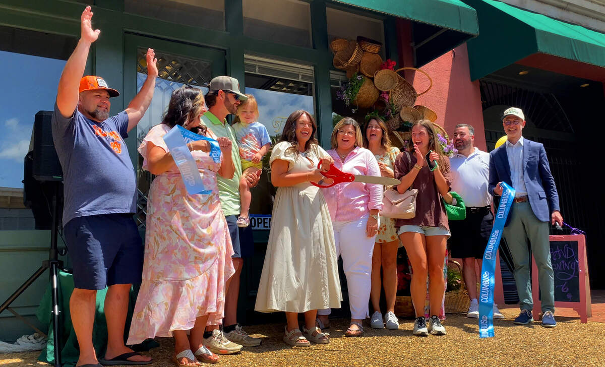 Lexiee Campbell, center, owner of Flowers on Tenth, celebrated the opening of her new boutique flower shop in Columbus with a ribbon-cutting ceremony and open house May 15, 2025.