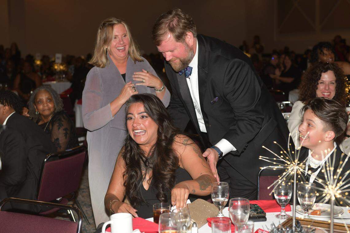 Amanda Zarate, a theater teacher at Wynnton Arts Academy, reacts to the news after she was announced as the Muscogee County School District 2025 Teacher of the Year during the Muscogee Educational Excellence Foundation gala May 1 in the Columbus Convention & Trade Center.