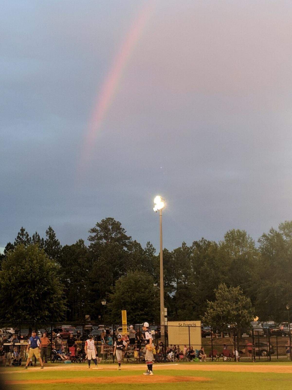 Carter Freiberg pitches during the Little League District 8 Tournament last week on the same day his mother, Kristal Freiberg, was buried. During the game a rainbow appeared over the field.