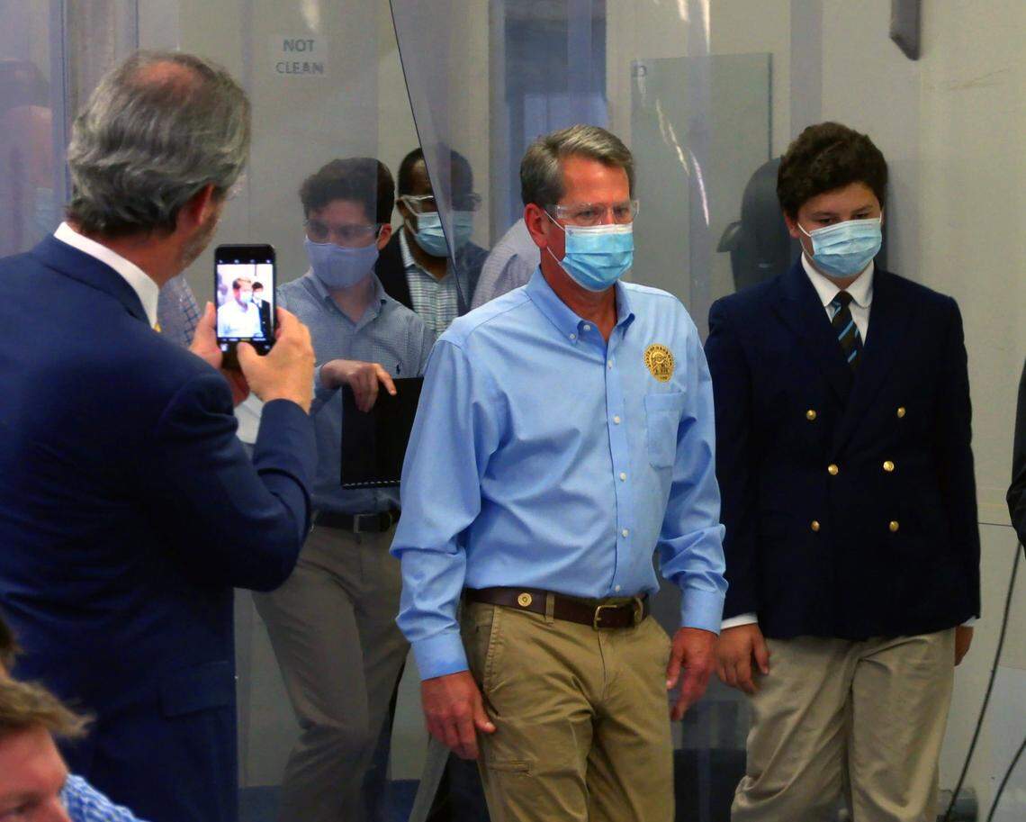Georgia Gov. Brian Kemp, center, visited High Performance Product Engineering in Columbus, Georgia Wednesday afternoon. Kemp first toured the facility before making remarks and answering questions from the media.