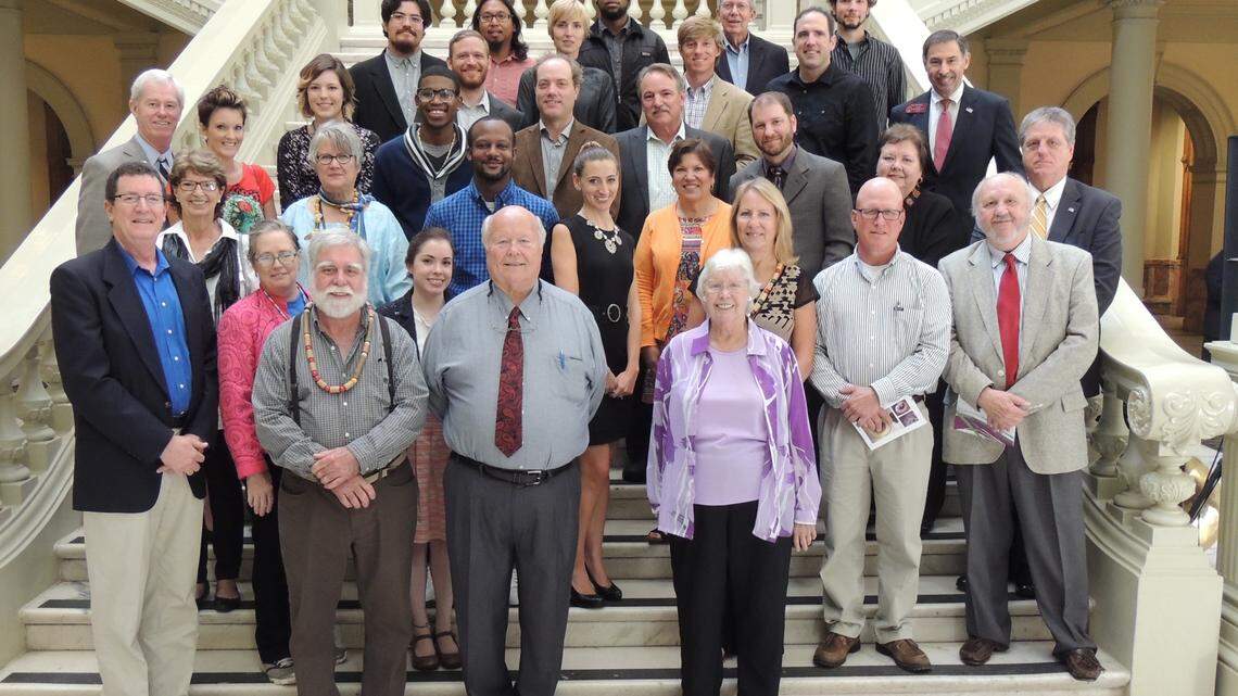 COURTESY OF COLUMBUS STATE UNIVERSITY 
 Members of the Pasaquan Preservation Society and a group from Columbus State University pose for a photo on the steps of the Georgia Capitol after Gov. Nathan Deal presented one of the 2015 Governor's Awards for the Arts and Humanities to the society Tuesday in Atlanta.
