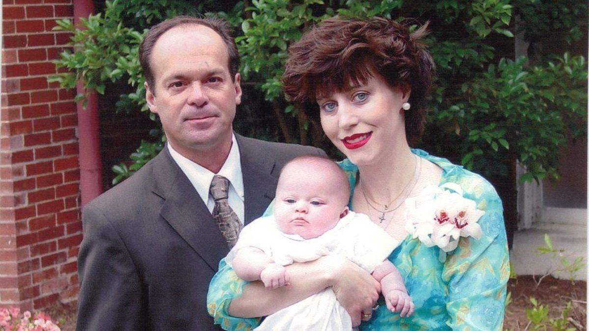 Albert Woolfolk, left, is pictured here with wife Frances and their infant son.