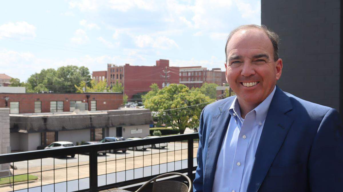 Ben Finley, 58, Attorney at The Finley Firm poses in front of his firm on 13th Street atop Nonic in Columbus, Georgia on Sept. 18, 2024.