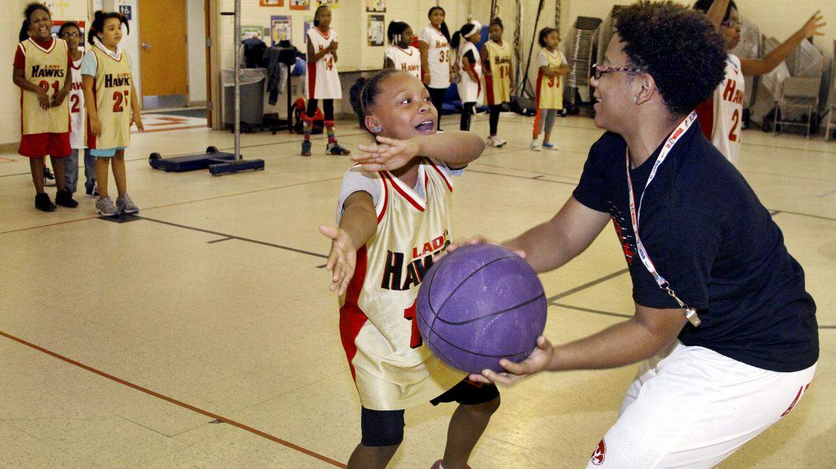 ROBIN TRIMARCHI rtrimarchi@ledger-enquirer.com 
 St. Marys Road Magnet Academy fifth-grader Celeste Scott learns to block the ball with Hardaway High's Serena Dent during an after-school basketball session in the St. Marys gym Tuesday. Several Lady Hawks spent time with the girls to teach them teamwork and offer motivational advice that goes beyond sports. The young students will play in a Hoops for Heart fundraiser for the American Heart Association at Shirley Winston Park on Friday, 5-7 p.m. 02.23.16