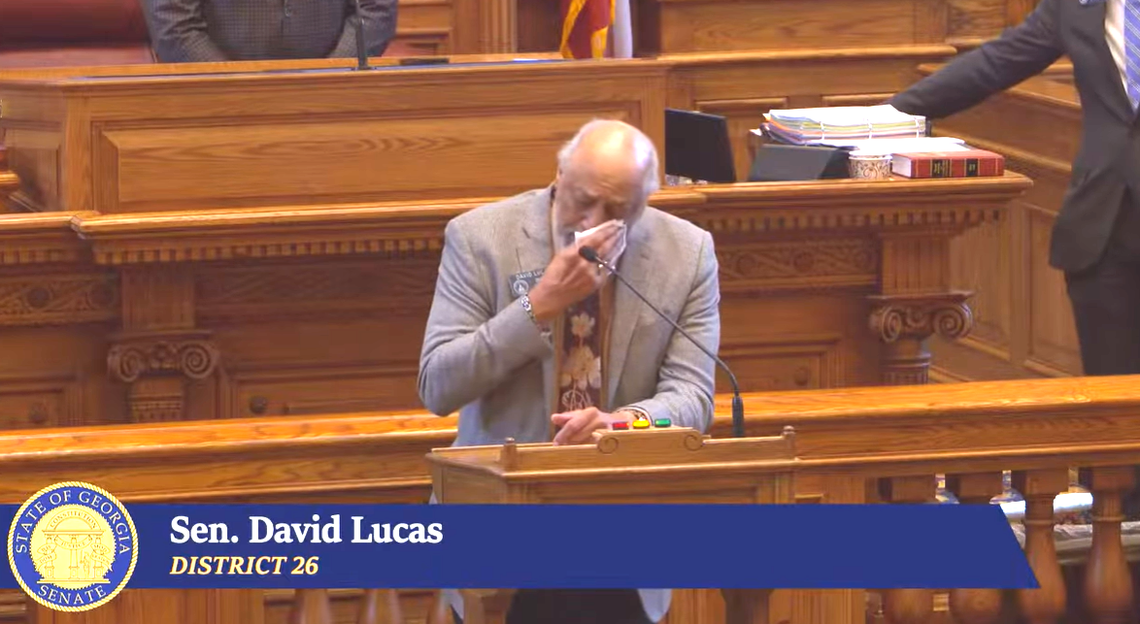 State Sen. David Lucas (D-Macon) wipes tears from his face as he speaks in the Georgia Senate on March 4, 2026, while honoring state Sen. Ed Harbison (D-Columbus), who announced he won’t seek re-election. At 33 years, Harbison is the longest-serving senator in this year’s senate. Lucas said Harbison also is the longest-serving state senator “of color” in Georgia history.