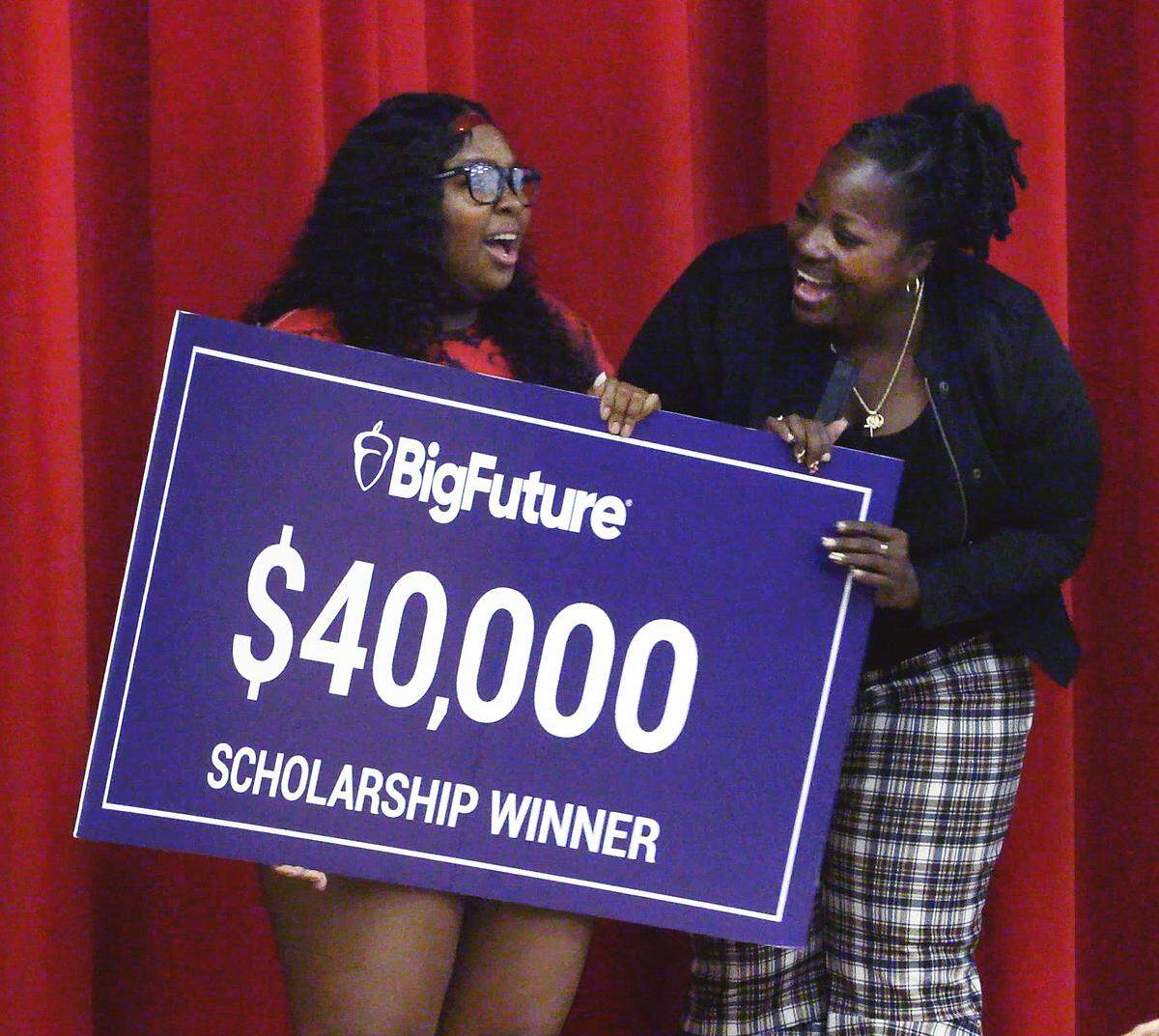 Hardaway High School senior E’lyssia Brown, left, is joined onstage by her mother Carlus Brown after Penny Damianeas, the College Board’s state and district partnerships director, announced E’lyssia is the recipient of a $40,000 scholarship. 01/19/2023