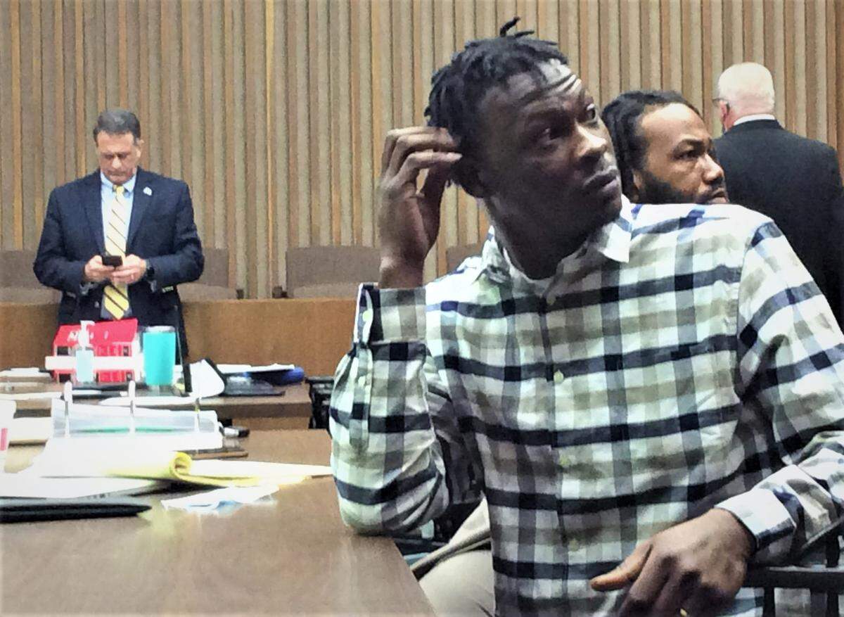 Demetrius Johnson gets ready to leave the courtroom during a recess after testifying he shot Jermaine Williams in self-defense in downtown Columbus.