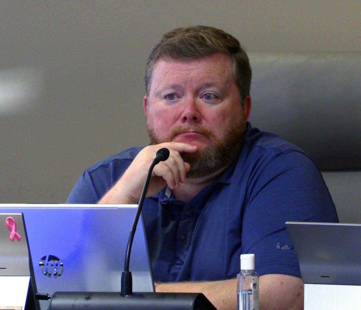 Brad Baker, a member of the Planning Advisory Commission, listens to a presentation by Dave Erickson, a builder and representative for Wizer Home Builders, LLC , about Wizer’s development proposal for 5201 Macon Rd. in Columbus, Georgia during a public hearing on Nov. 20, 2024.