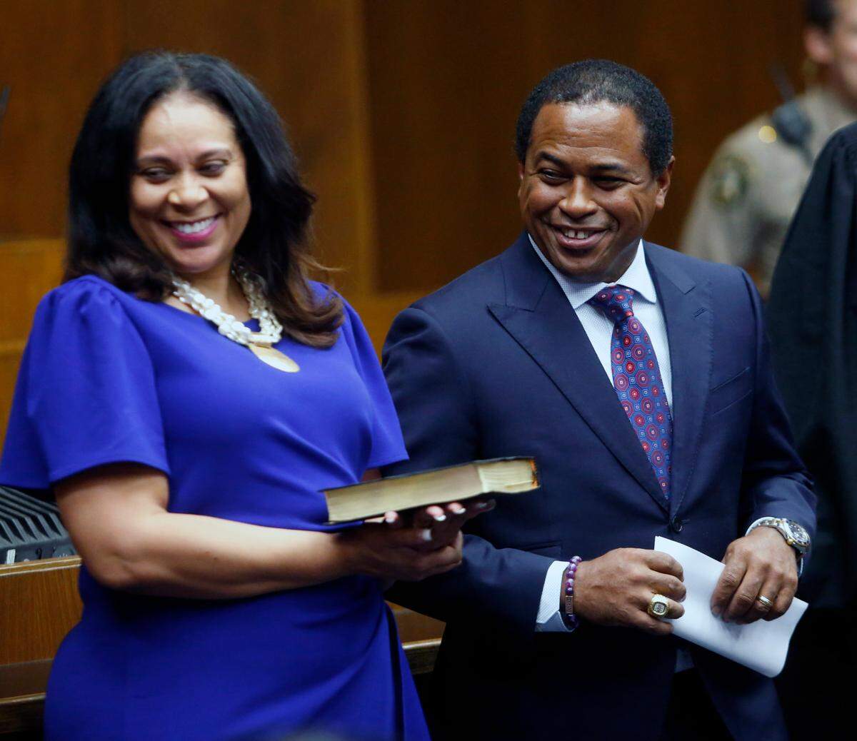 Travis Chambers, right, was sworn into Columbus City Council by Superior Court Judge Arthur L. Smith III in early July. Holding the bible is Chambers’ wife Kia. 07/03/2024