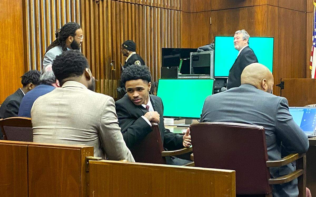 Defendant Jahiem Davis, center, turns around to speak with defense attorney Mark Lee during the alleged “Insane Crips” murder trial in Muscogee Superior Court.