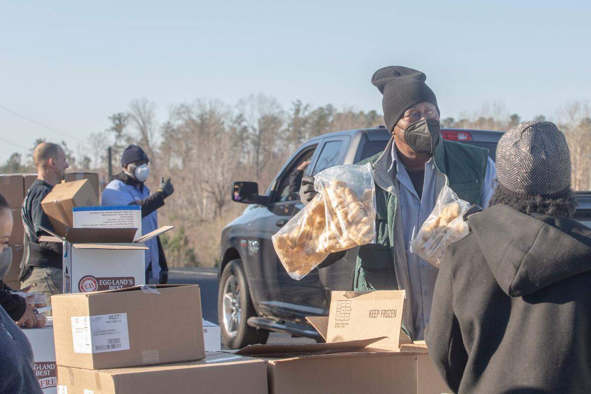 Feeding the Valley truck driver Fletcher Owens helps distribute food at a mobile pantry site in Hamilton, Ga. on Jan. 27, 2022.