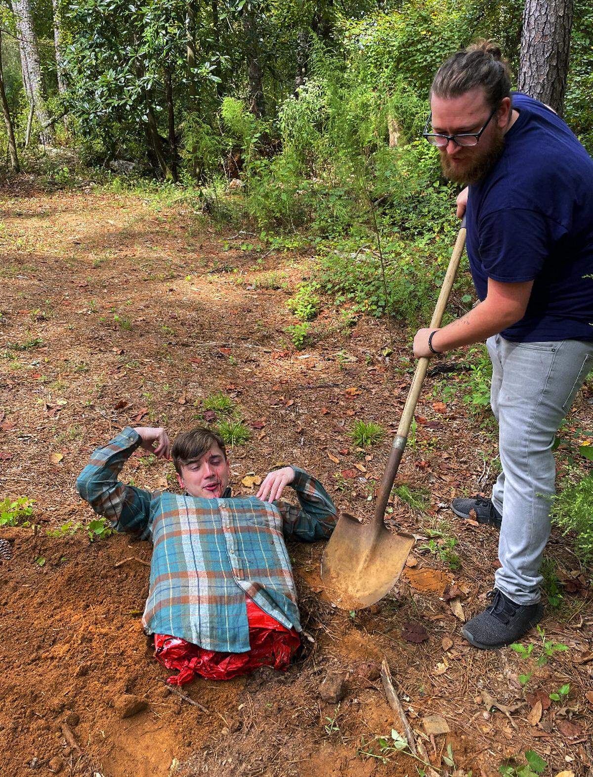 Andrew Gray, right, director of “Manphibian,” preps one of the film’s scenes prior to filming.