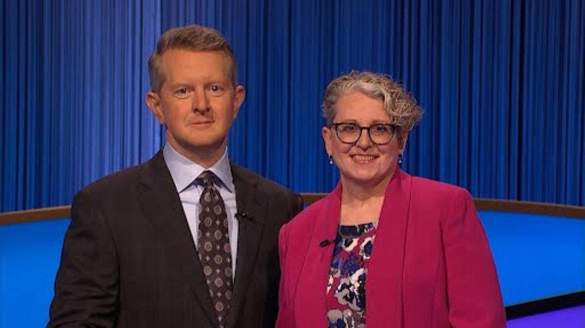 Auburn local Lee Wilkins poses with Jeopardy! host Ken Jennings during her appearance on the hit show.