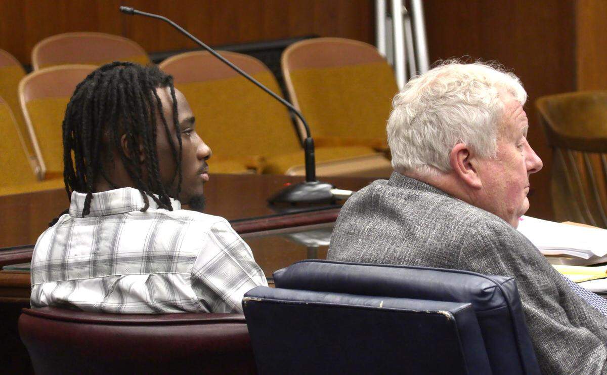 On trial for murder in the death of Travis Henry Jr., Lydell Sparks is represented by Columbus attorney Michael Garner, right.