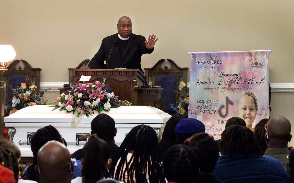 Pastor T. Brian Hill delivers the eulogy at the funeral of Kamarie Holland, 5, Wednesday at Taylor Funeral Home in Phenix City, Alabama.