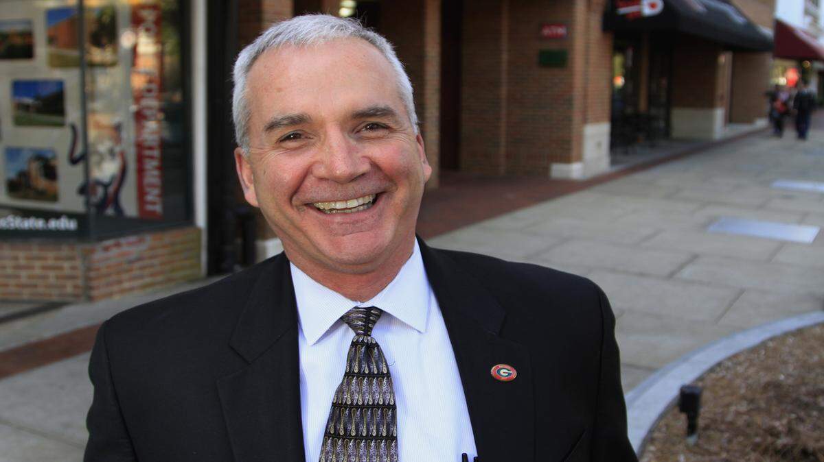 Mark Lupo, area director of the University of Georgia Small Business Development Center in Columbus, is shown on Broadway near space where he and wife, Elaine, once operated an art gallery. The former retail space is now a Columbus State University Police precinct office. 02/11/16