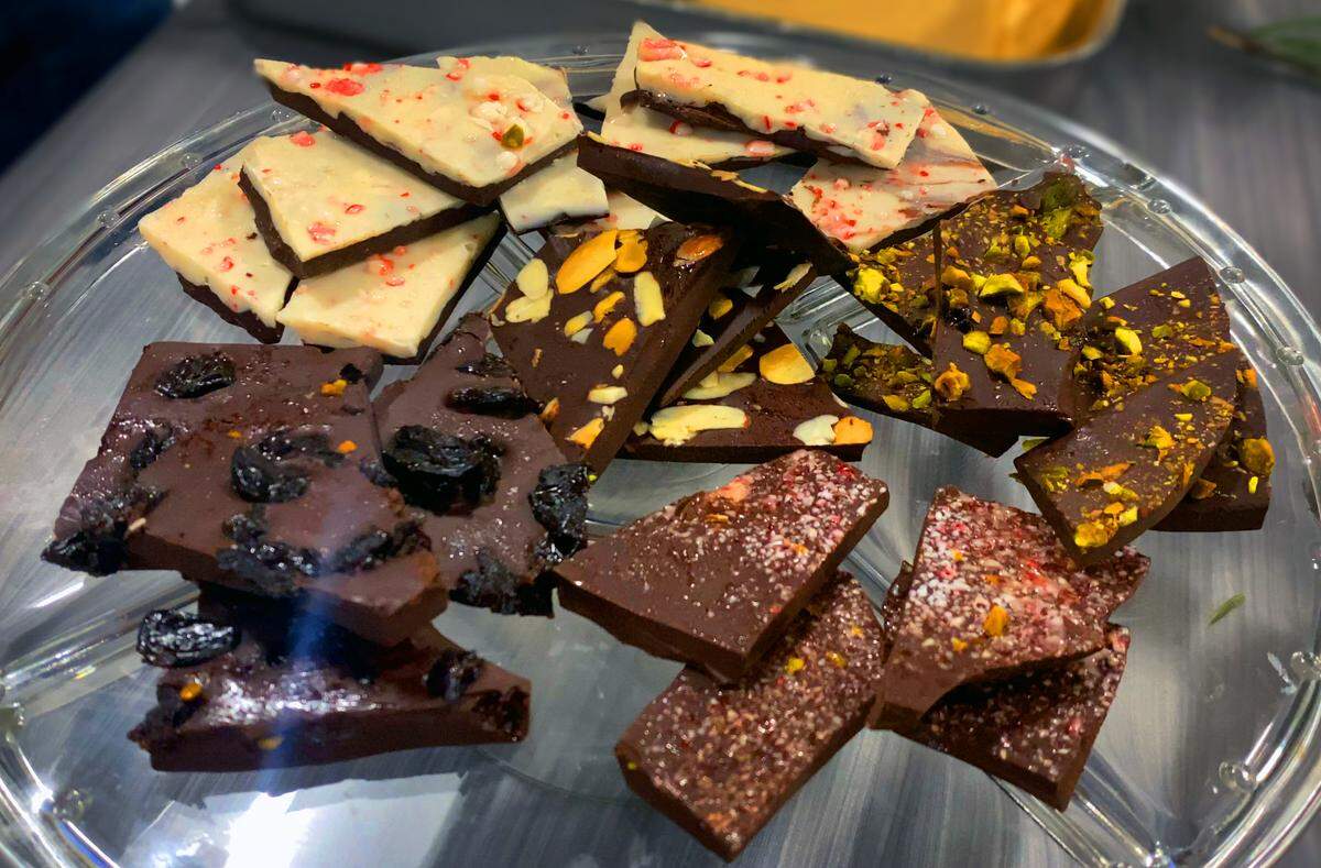 You can customize Dark Chocolate Bark by adding several toppings including crushed peppermint sticks, dried cherries, and pistachios.