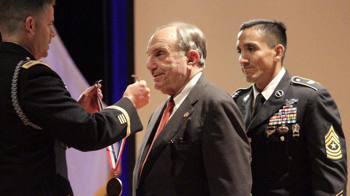 Former Columbus mayor and Retired Col. Robert Poydasheff, center, is inducted into the Ranger Hall of Fame as an honoree by Col. John Cowbell, left, and Command Sgt. Maj. Alexander Kupratty.