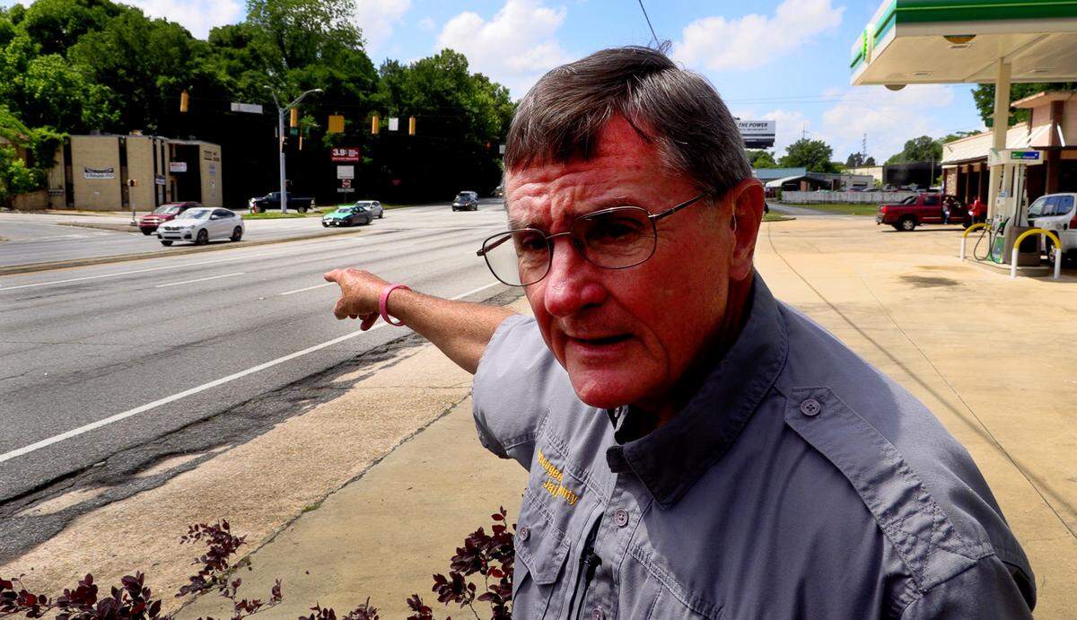 Neil Richardson, chaplain at the Muscogee County Jail and director of SafeHouse, points out the dangers of crossing Veterans Parkway near 23rd Street in Columbus.