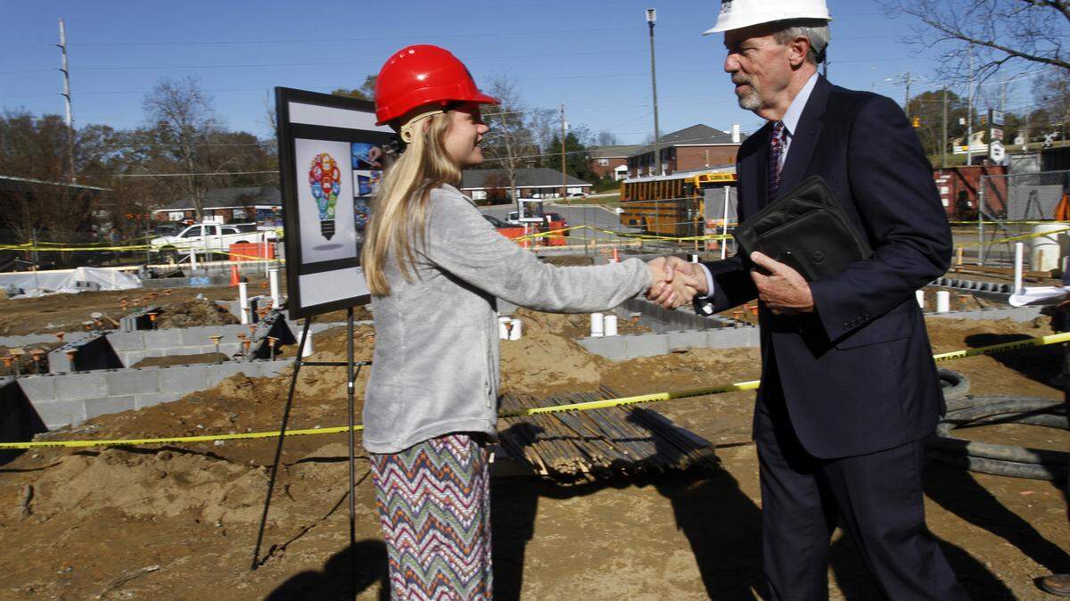 ROBIN TRIMARCHI rtrimarchi@ledger-enquirer.com 
 Alabama State Department of Education Superintendent Tommy Bice, right, introduces himself to sixth-grade junior journalist Jade Paul during a tour Tuesday of the construction site for the $2.1 million Dyer Family STEM Center, scheduled to open at Phenix City Intermediate School in August. 12.15.115