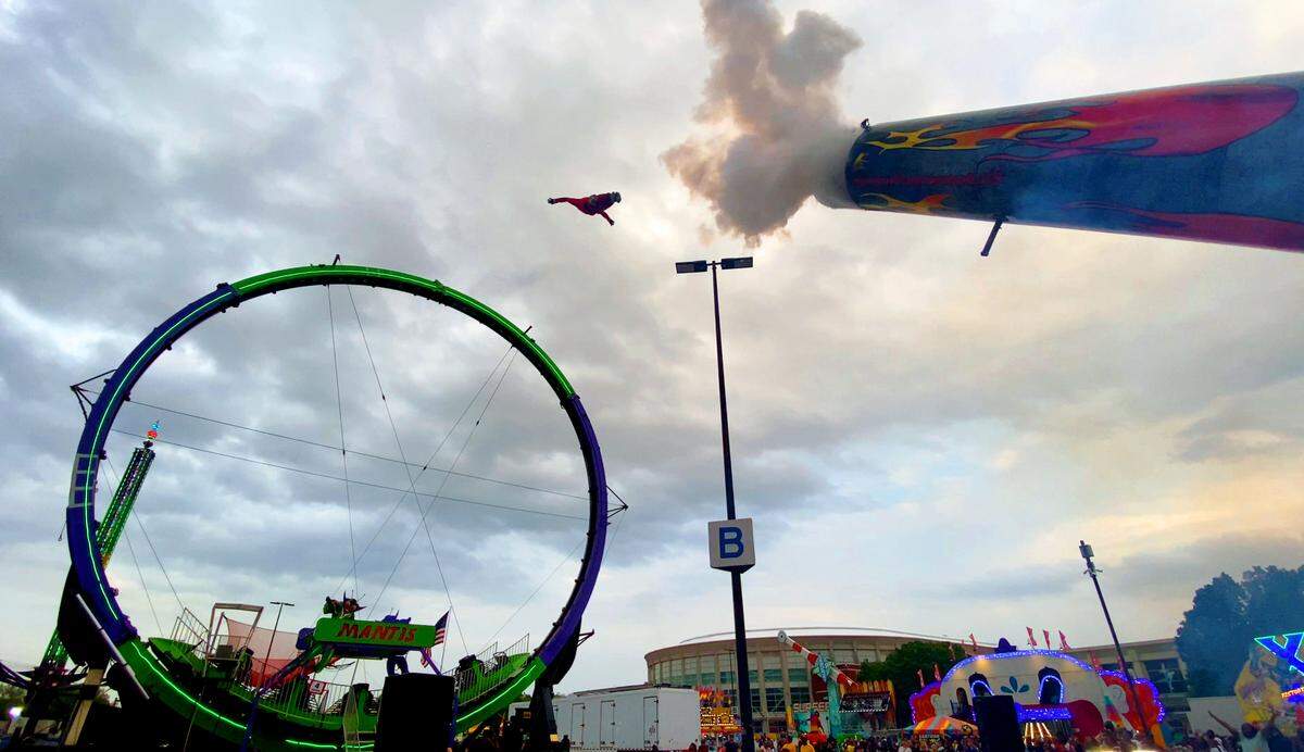 David Smith Jr., a second generation human cannonball known as “The Bullet,” is shot from a cannon Tuesday night at the Spring Fling carnival at the Columbus Civic Center in Columbus. 04/02/2024
