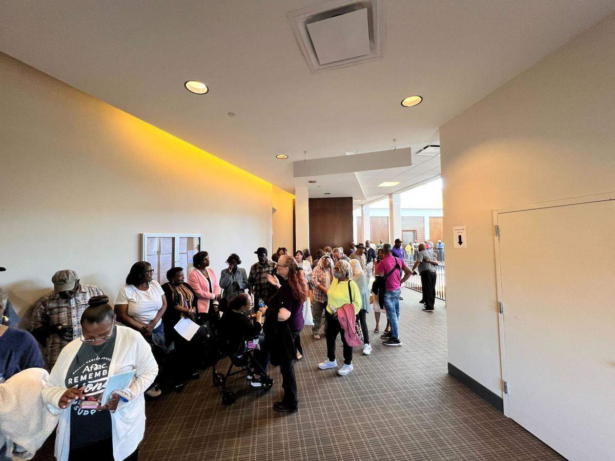 A queue of Columbus residents wraps around the City Services Center ahead of the March 25 Columbus Council meeting, which was the first meeting after a controversial vote appointing Councilor John Anker.