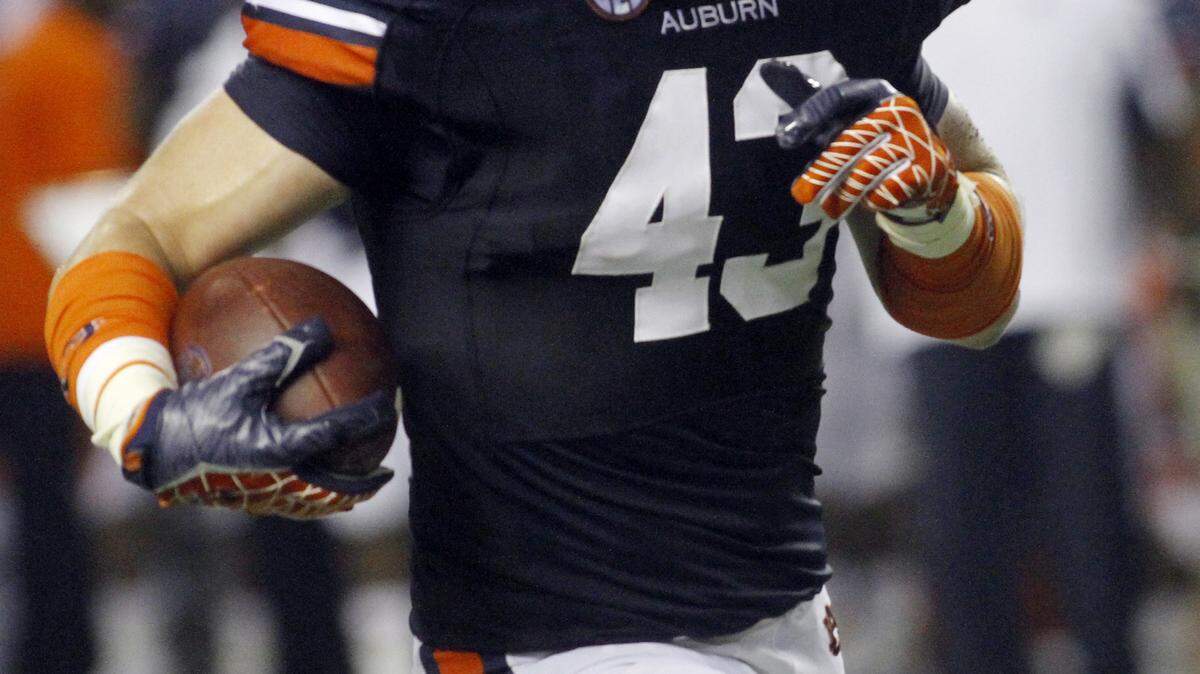 ROBIN TRIMARCHI rtrimarchi@ledger-enquirer.com 
 Auburn tight end Philip Lutzenkirchen runs for additional yards after a pass reception against Clemson in the Georgia Dome Saturday. 09.01.12