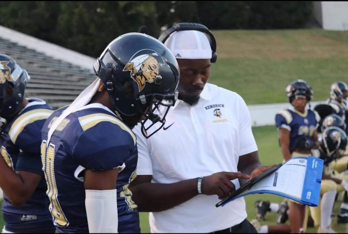 Emmanuel Brown coaches a Kendrick High School football player in this undated photo. Brown was the defensive coordinator for the Cherokees before being promoted to head coach Jan. 18, 2024, after the resignation of Robert Martin Jr.