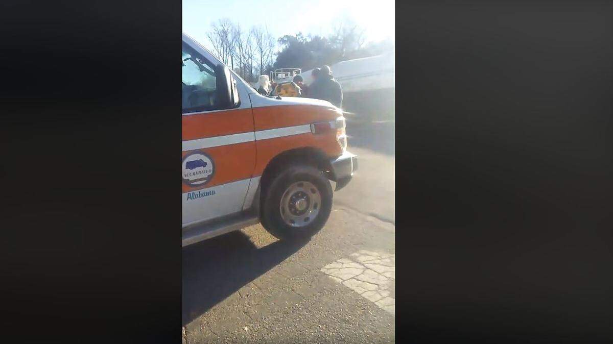 Neighbors in Leeds, Alabama were forced to pass a man over a train Tuesday after it was blocking an ambulance from reaching him.